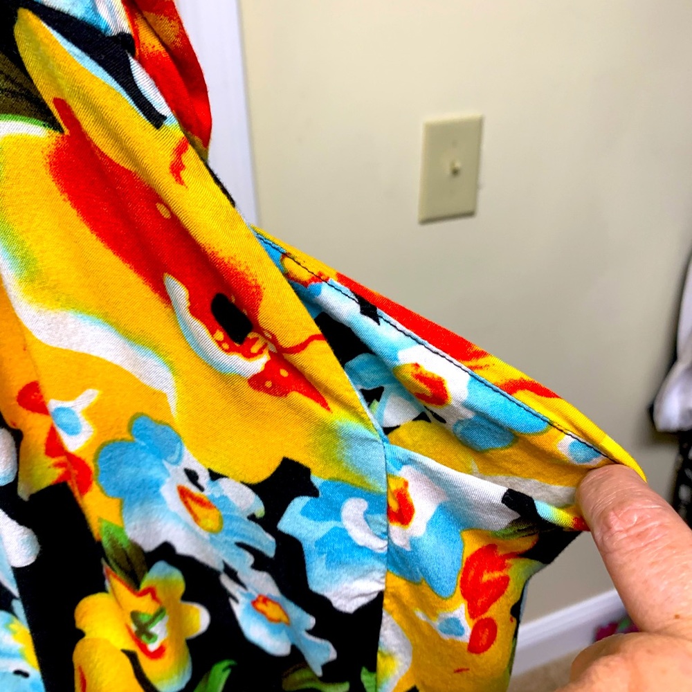 Bright colored sundress with pockets. Ruching in back.